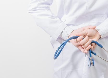Doctor with stethoscope on white backgroundの写真素材