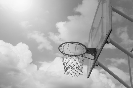 Basketball hoop on a blue sky , black and whiteの写真素材