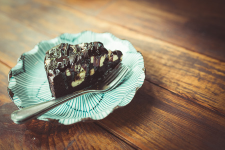 The chocolate cake on wood teble. ,  vintage toneの写真素材
