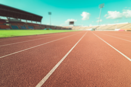 Red running track in stadium , vintage toneの写真素材