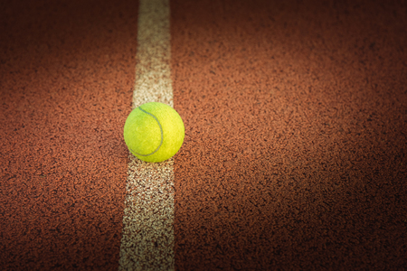 Close up of tennis ball on clay court./Tennis ball ,  vintage toneの写真素材