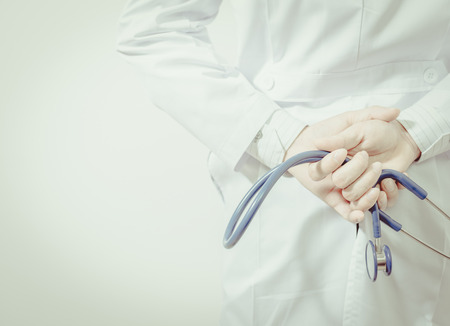 Doctor with stethoscope on white background , vintage toneの写真素材