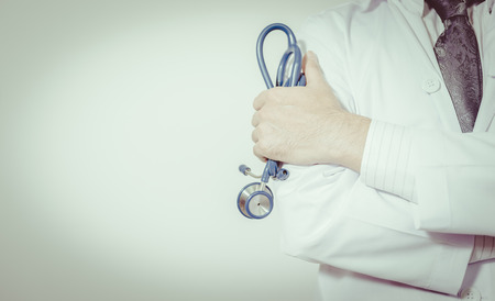 Doctor with a stethoscope in the hands , vintage toneの写真素材