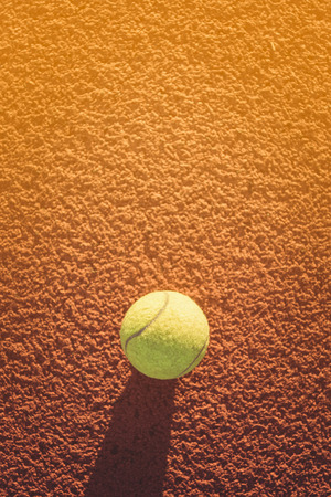 Close up of tennis ball on clay court./Tennis ball ,  vintage toneの写真素材