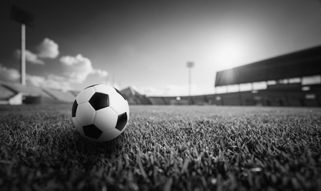 Soccer ball on the grass in soccer stadium , Black and white.の写真素材