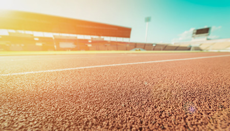 Red running track in stadium , vintage toneの写真素材