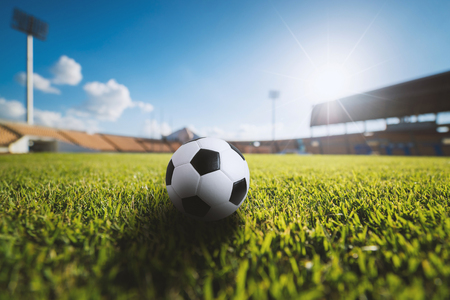 Soccer ball on the grass in soccer stadium. soccer ball concept background.の写真素材