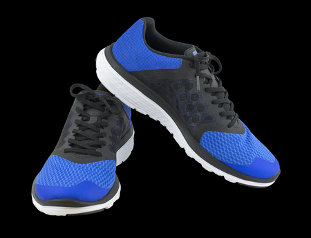 Pair of blue sport shoes on black background. Sport shoes isolated. File contains a clipping path.の写真素材