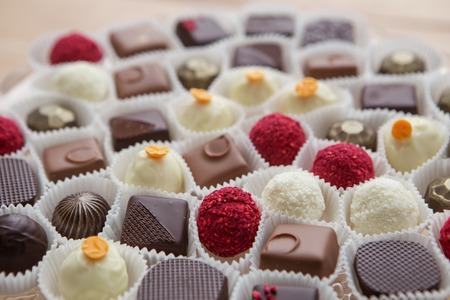 assortment tasty chocolate desserts on wooden tableの写真素材