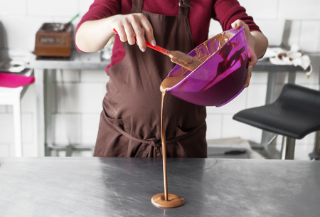 manufacturing of handcrafted chocolate candies in daylightの写真素材