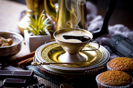 Black coffee in a cup on old backgroundの写真素材