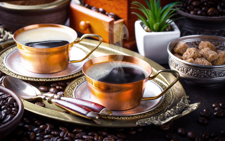 Black coffee in a cup on old backgroundの写真素材