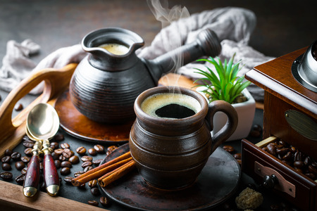 Black coffee in a cup on old backgroundの写真素材