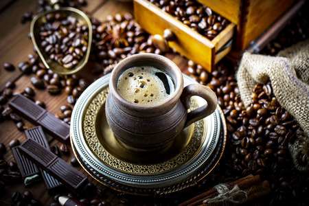 Coffee in a cup on old backgroundの写真素材