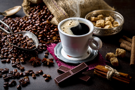 Coffee in a cup on old backgroundの写真素材