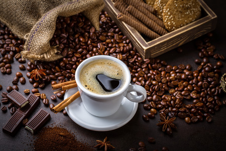 Coffee in a cup on old backgroundの写真素材