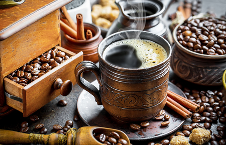 Coffee in a cup on old backgroundの写真素材