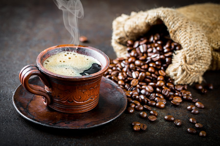 Coffee in a cup on old backgroundの写真素材