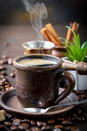 Coffee in a cup on old backgroundの写真素材