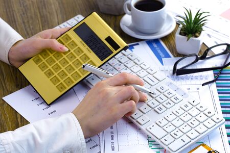 Female hands with items for businessの写真素材