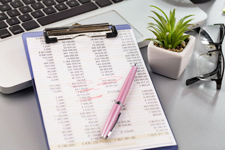 Close-up Of A Businessman's Desk With Financial Charts