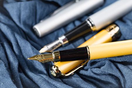 Fountain pen on blue fabric background, closeup. Business brandingの写真素材