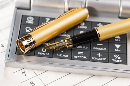 Calculator and fountain pen on table close up. Business accountingの写真素材