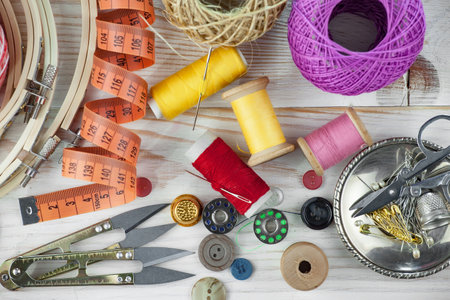 Sewing accessories on a wooden background. Sewing, needlework.の写真素材