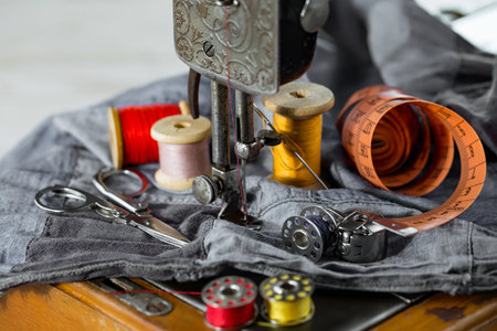 Sewing machine with threads and needles on fabric, closeupの写真素材