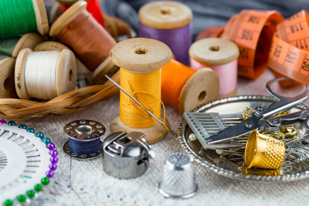 Sewing accessories for needlework on a wooden background. Selective focus.の写真素材