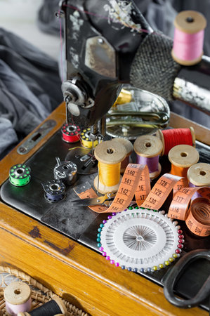 Sewing machine and sewing accessories on table in workshop, closeupの写真素材