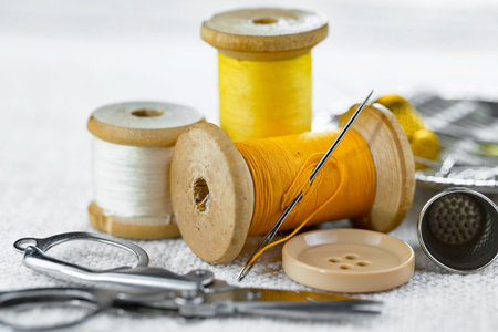 Threads, needles and sewing items.