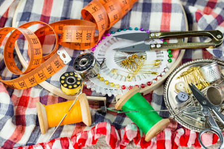 Threads, needles and sewing items.