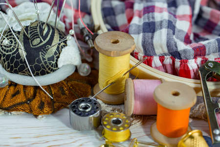 Threads, needles and sewing items.