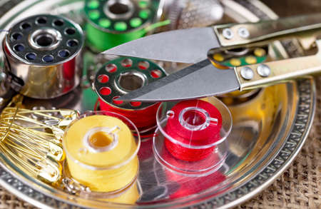Threads, needles and sewing items.