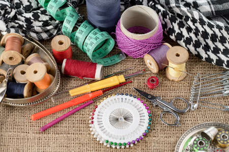 Threads, needles and sewing items.