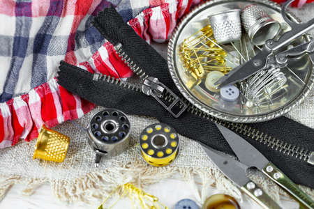 Threads, needles and sewing items.