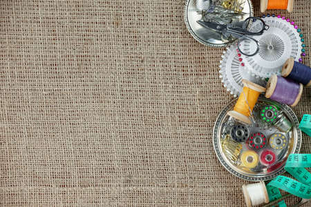 Threads, needles and sewing items.