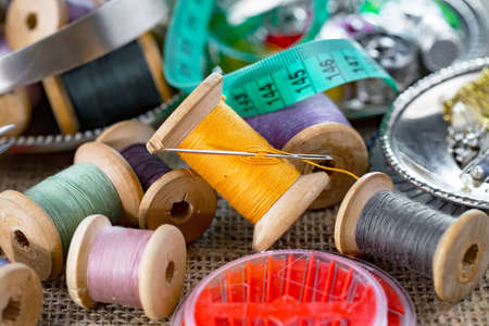 Threads, needles and sewing items.