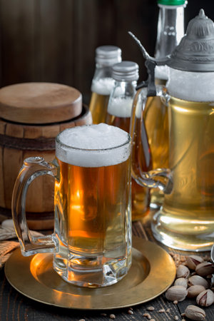 Light beer in a glass on an old background. Selective focusの写真素材