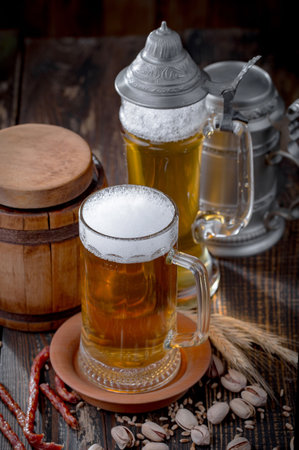 Light beer in a glass on an old background. Selective focusの写真素材