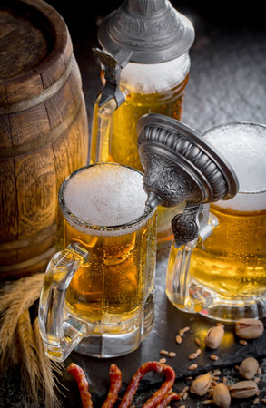 Light beer in a glass on an old background. Selective focus.の写真素材