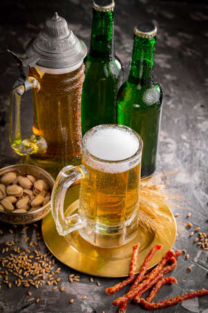 Light beer in a glass, on an old background.の写真素材