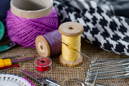 Sewing accessories for needlework on a table in a workshop