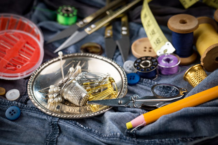 Sewing tools and accessories for needlework on jeans background.の写真素材