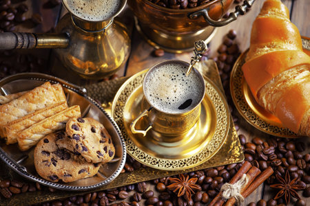 Coffee in a cup and saucer on an old backgroundの写真素材