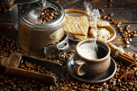 Black coffee on an old background in composition with accessories on the tableの写真素材