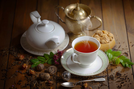 Tea on the table in composition with accessories on the theme of tea