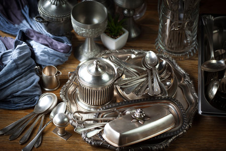 Vintage silverware on a wooden table. Selective focus.