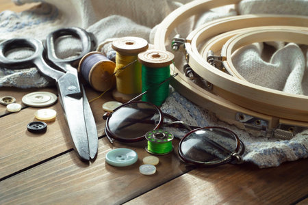 Sewing accessories on a wooden background. Sewing kit.